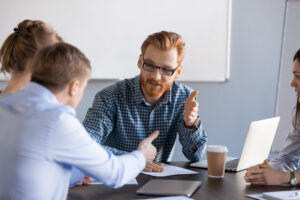 Expert discussing in a meeting with students or colleagues.
