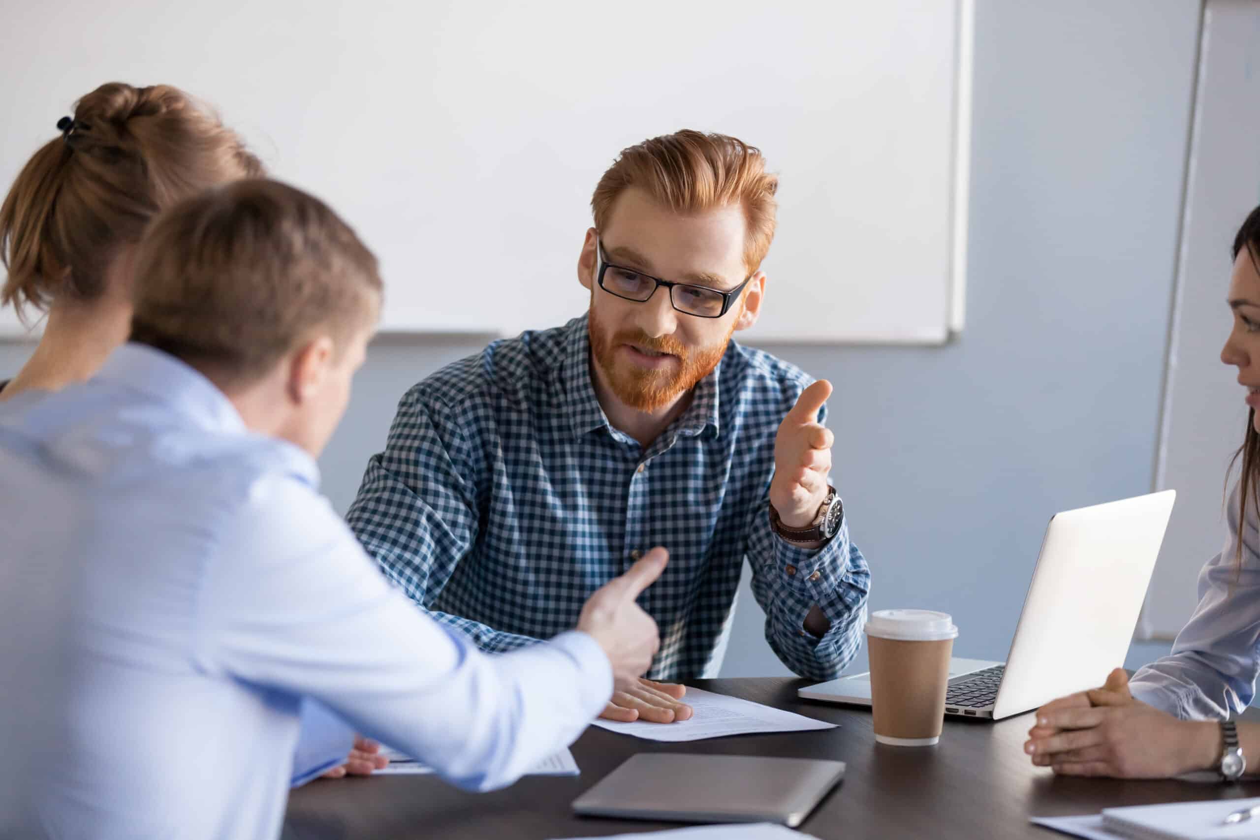 Expert discussing in a meeting with students or colleagues.